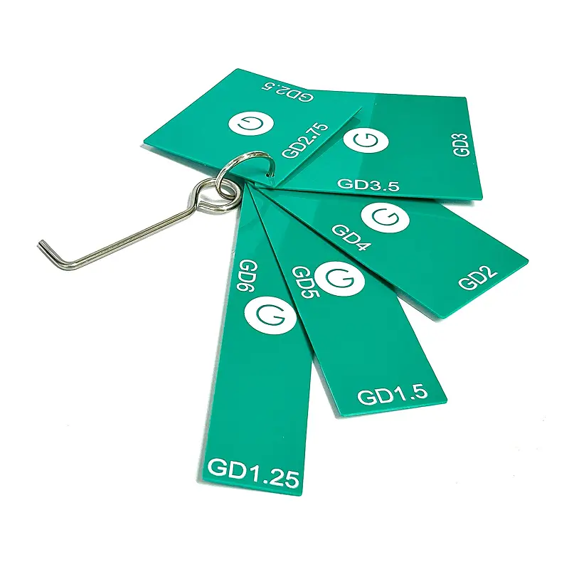Green Drain measuring tool keychain with cutouts for all 8 drain sizes